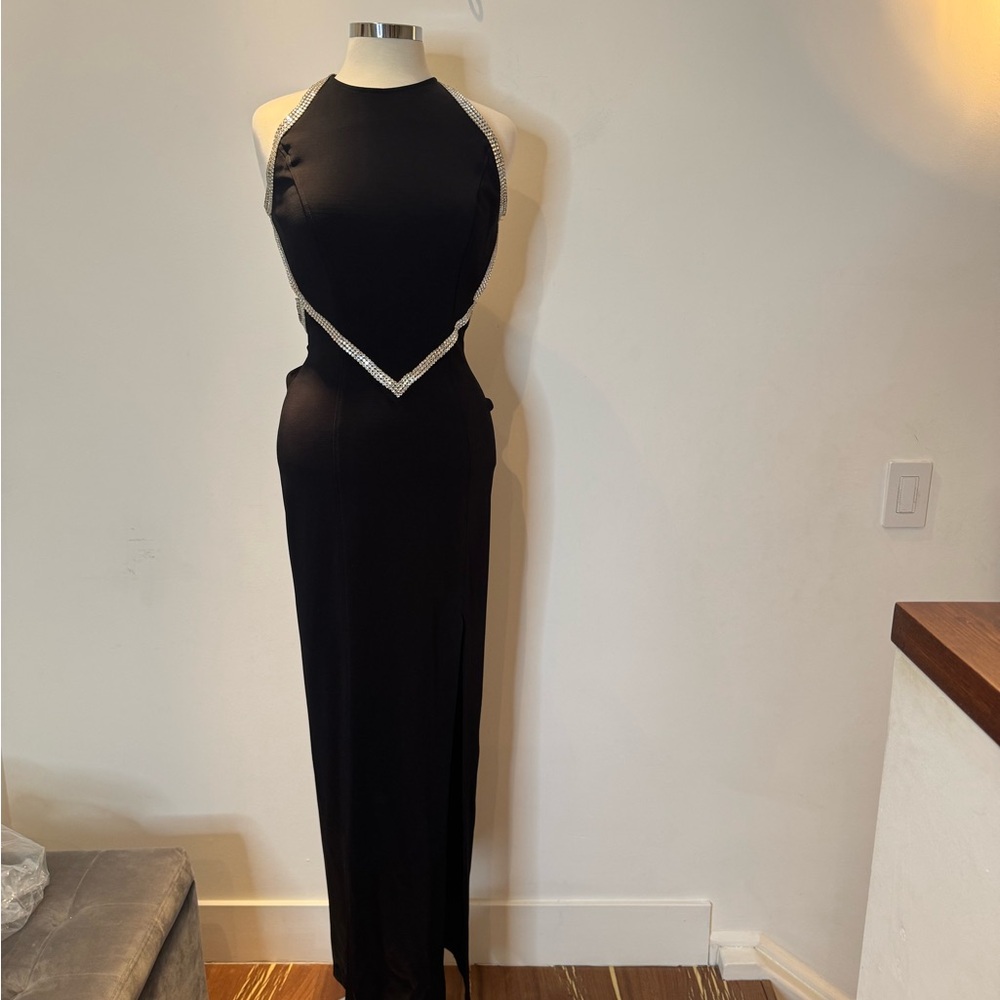 Nicole Bakti Black Gown with rhinestone details.
Late 1990s. Size 12.